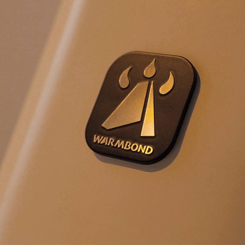 WARMBOND brand laser logo featuring tent and flame design