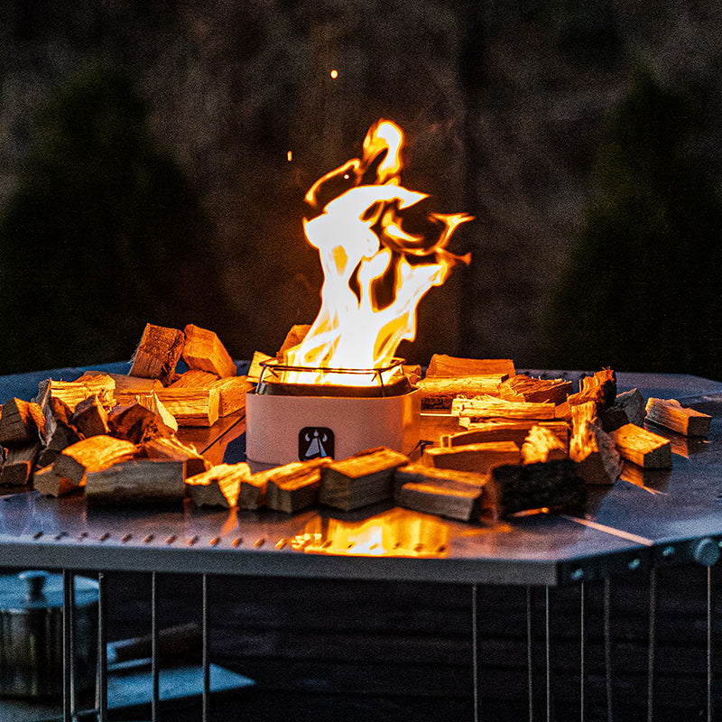WARMBOND BondStove Mini multi-fuel fire pit burning wood pellets with smokeless flame.