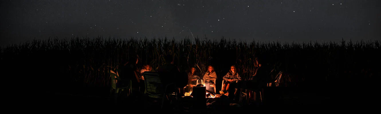 family-gathering-around-campfire