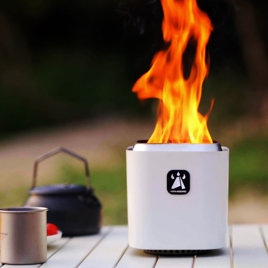 WARMBOND BondStove Mini portable smokeless fire pit in white generating clean flames for outdoor camping and patio use